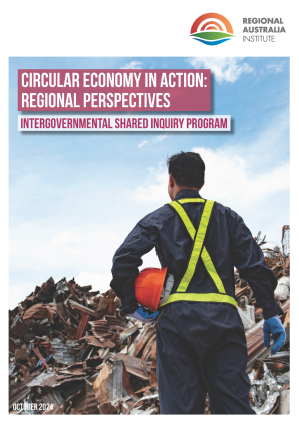 Cover image of the Circular Economy in Action: Regional Perspectives report features a person in overals and a high vis safety vest in front of a pile of building waste